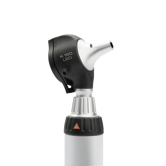 Black HEINE K180 otoscope head on top of a silver batter handle displayed against a white background.