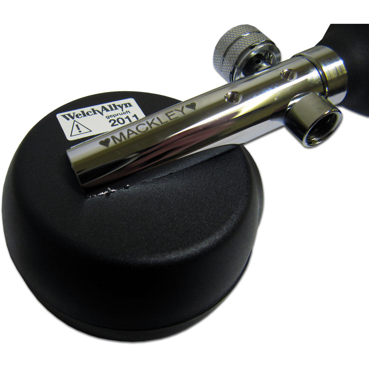 Back of the Welch Allyn DuraShock DS55 Sphygmomanometer with a heart, "MACKLEY" and a heart engraved on the meral tubing. Displayed against a white background.