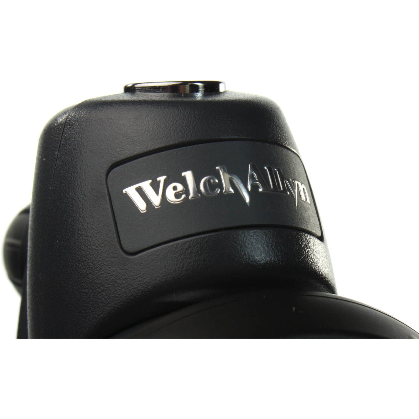 Close up of the top of the Welch Allyn DuraShock DS58 Sphygmomanometer showing the Welch Allyn logo embossed in silver on the front of the head of the sphyg. Displayed against a white background.