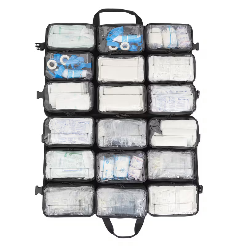 A large black open Elite Bags TRIA modular panel with multiple clear plastic pockets, shown fully packed with medical supplies such as bandages, gauze, and tourniquets, on a solid white background.