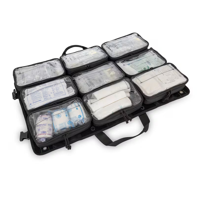 An open black Elite Bags TRIA modular panel organizer with multiple zippered compartments containing white medical supplies, shown on a plain white background.
