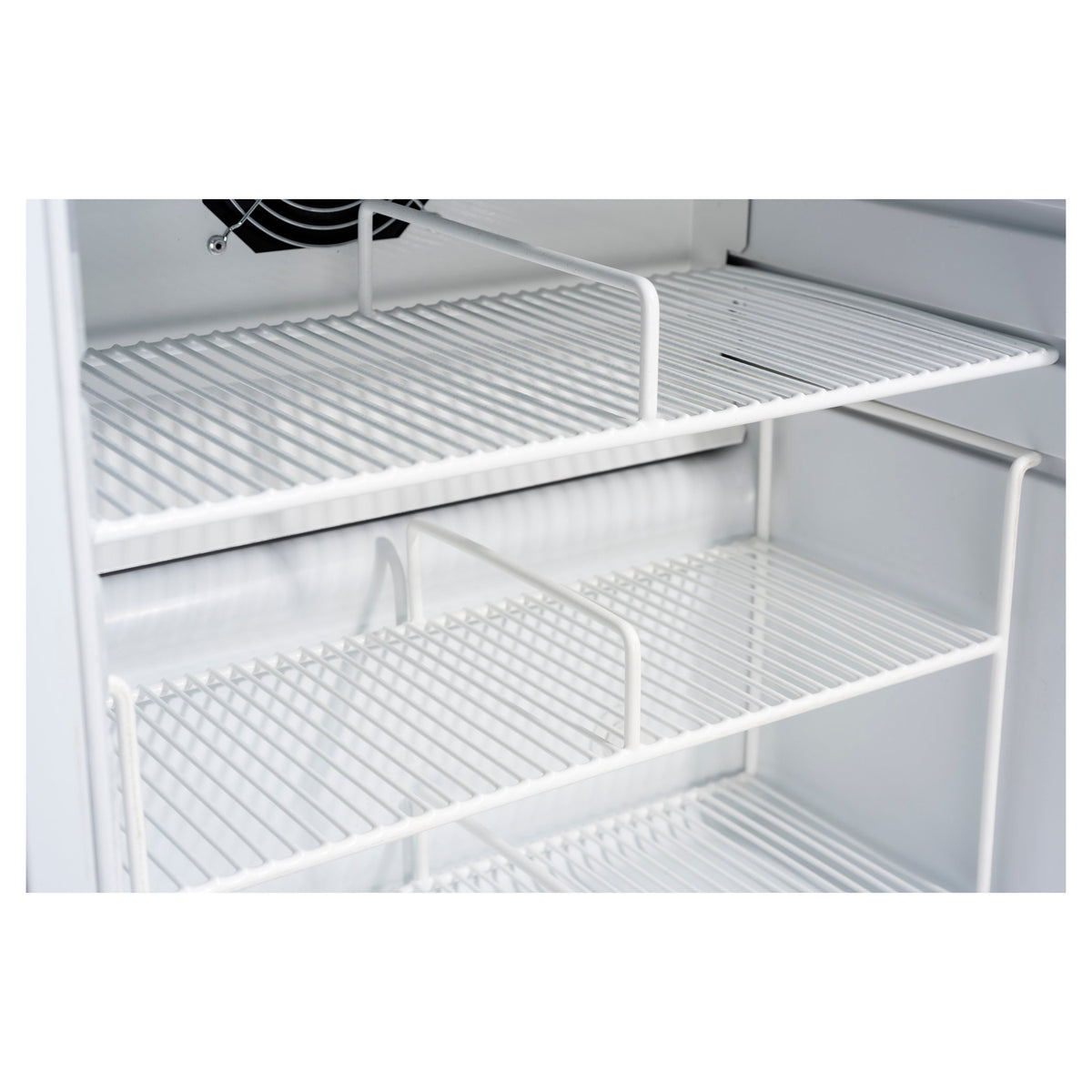 White wire shelving inside a refrigerator compartment, with multiple horizontal racks and a black fan visible at the top.